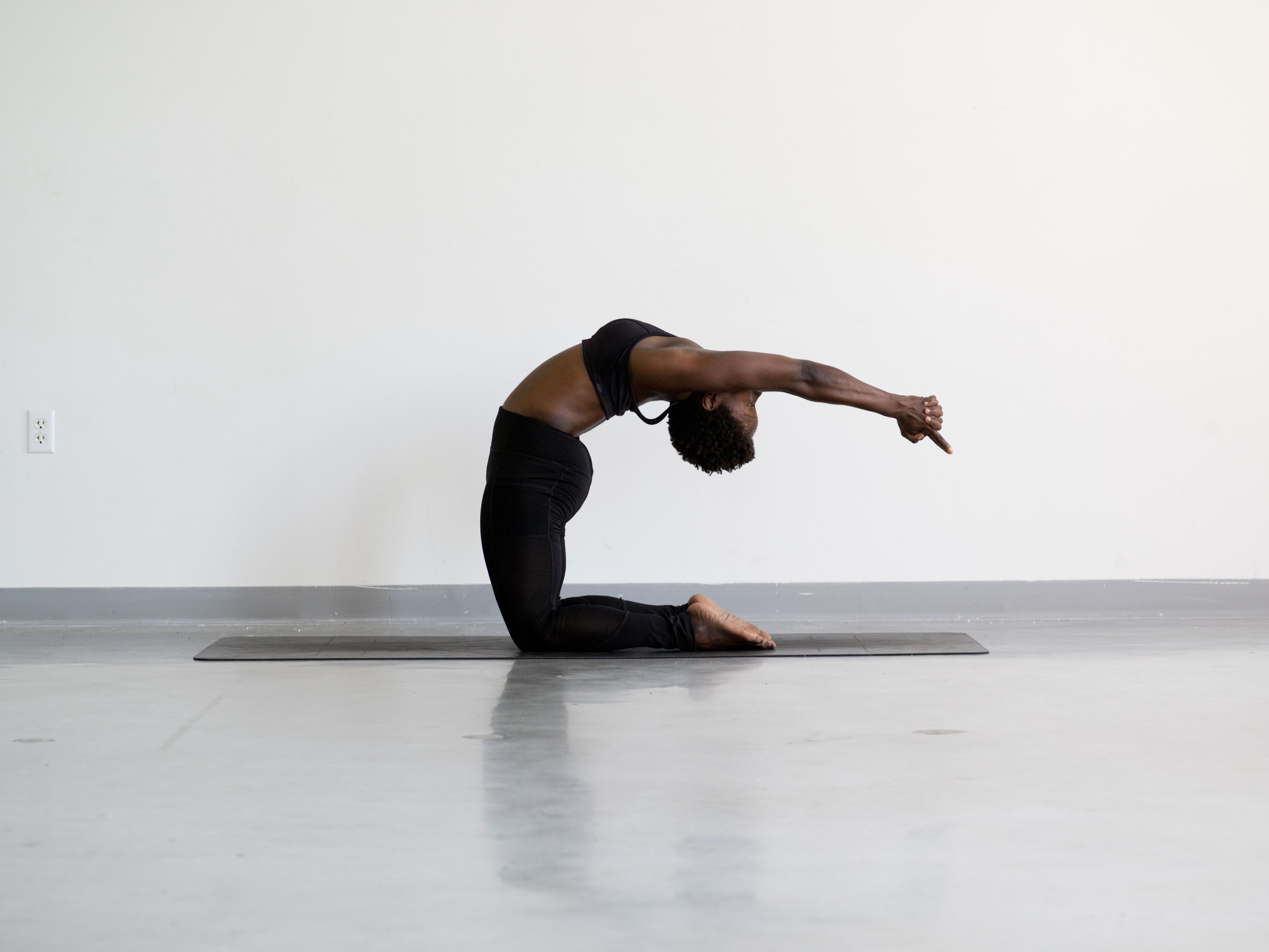 yoga – camel pose. - here. wellbeing - here. wellbeing